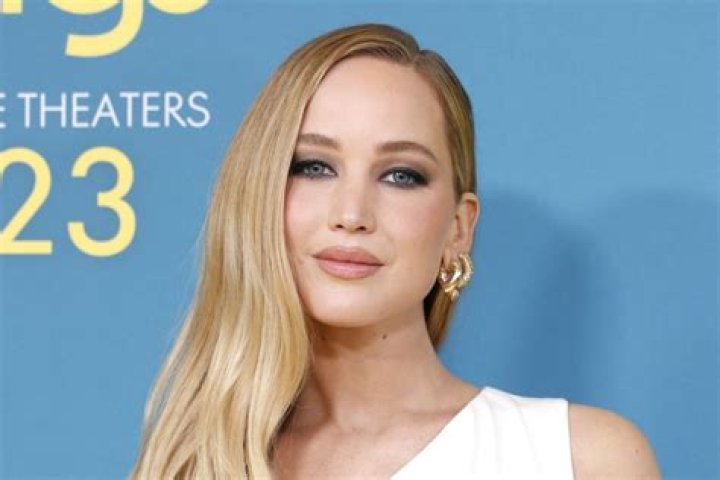 Jennifer Lawrence’s Huge Cleavage Spills Out Of Tight Dress As She Flaunts Diamond Ring